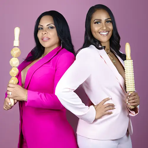 Wellness professionals showcasing maderoterapia body contouring tools during a branding photoshoot