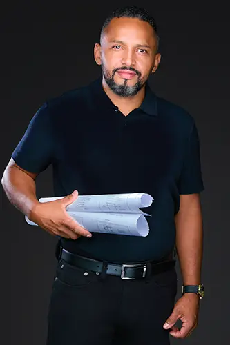 Construction professional holding architectural plans during a branding photography session in New York