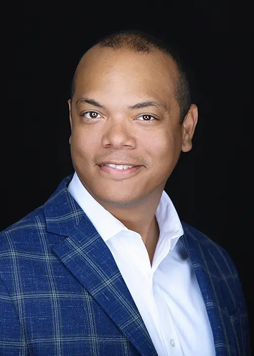 Professional headshot of a male business professional photographed in Queens, New York