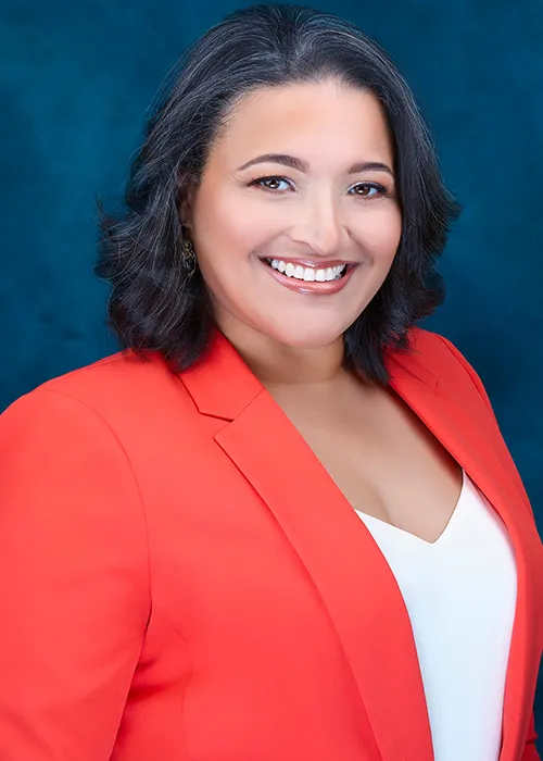 Professional headshot of a businesswoman photographed in Queens, New York